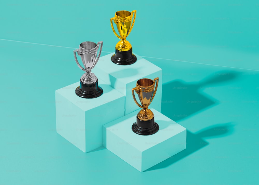 three trophies sitting on top of each other