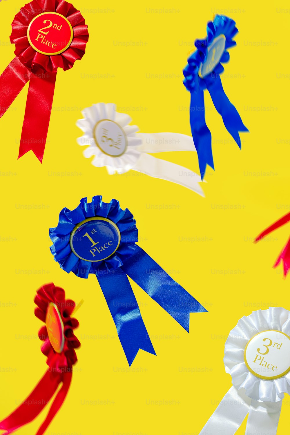 a group of ribbons on a yellow background