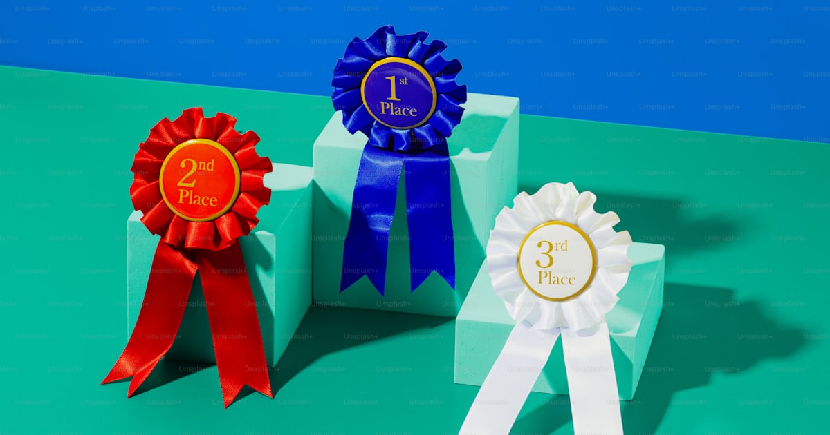 Three award ribbons sitting on top of each other photo – Goal setting ...