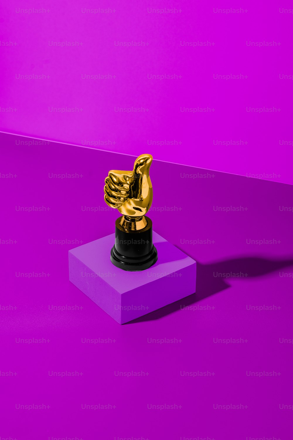 a purple and purple background with a gold statue