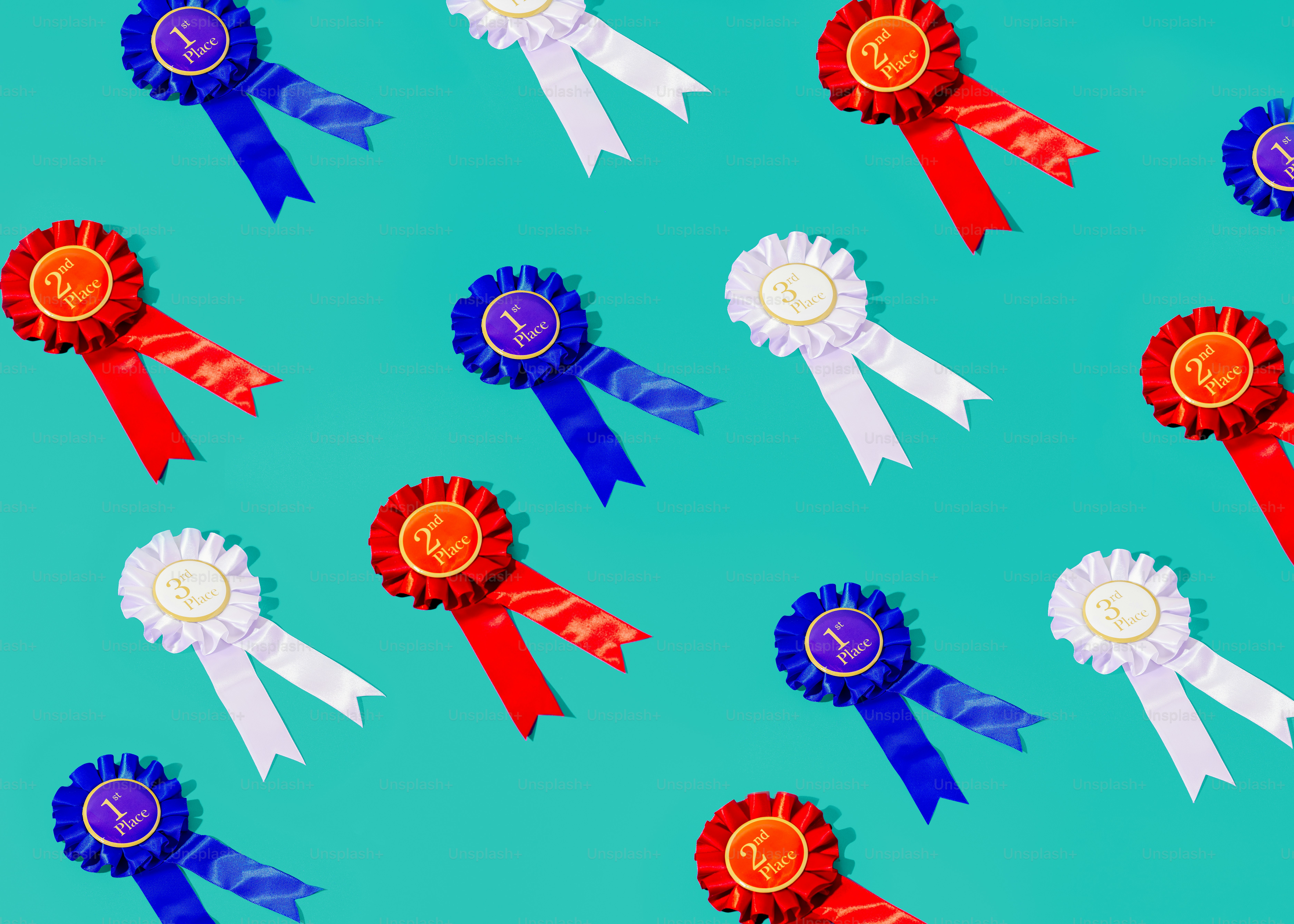 a group of red, white, and blue ribbons on a blue background