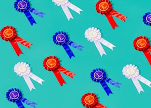 a group of red, white, and blue ribbons on a blue background