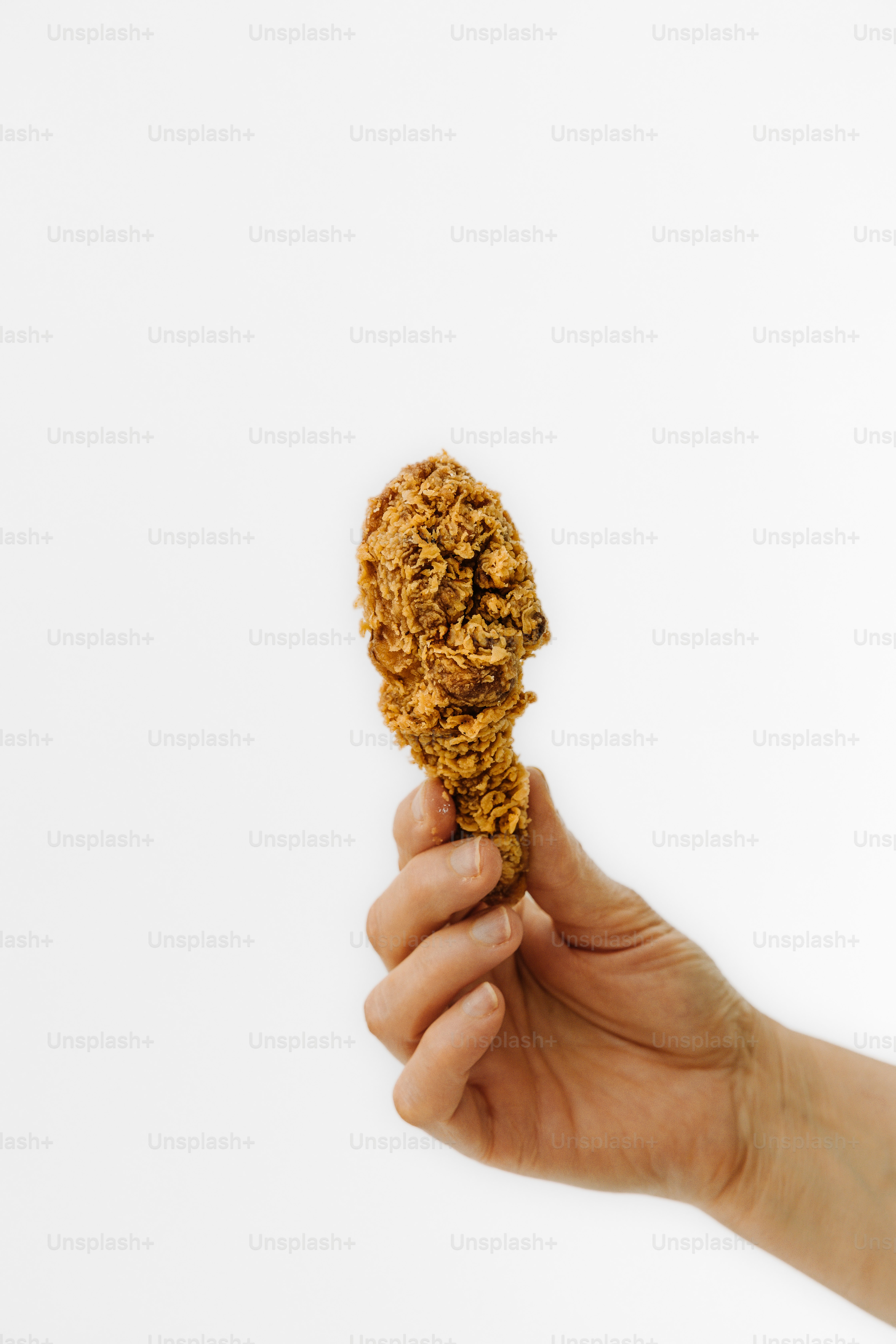 a person holding a cookie in their hand