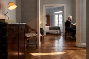 a person sitting at a table in a room