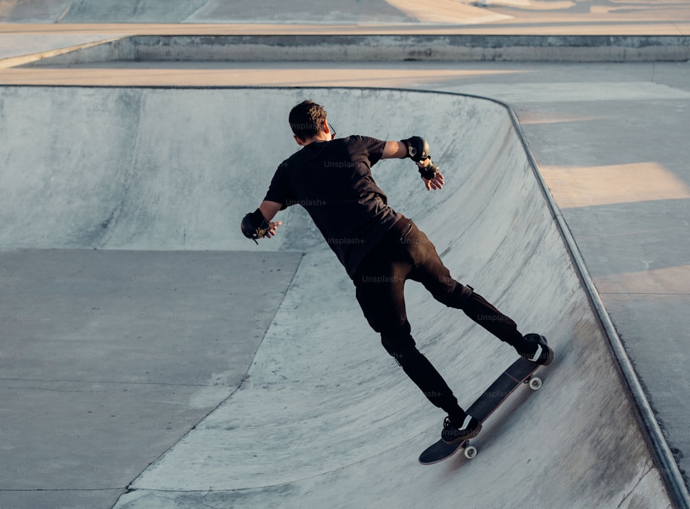 a man riding a skateboard up the side of a ramp