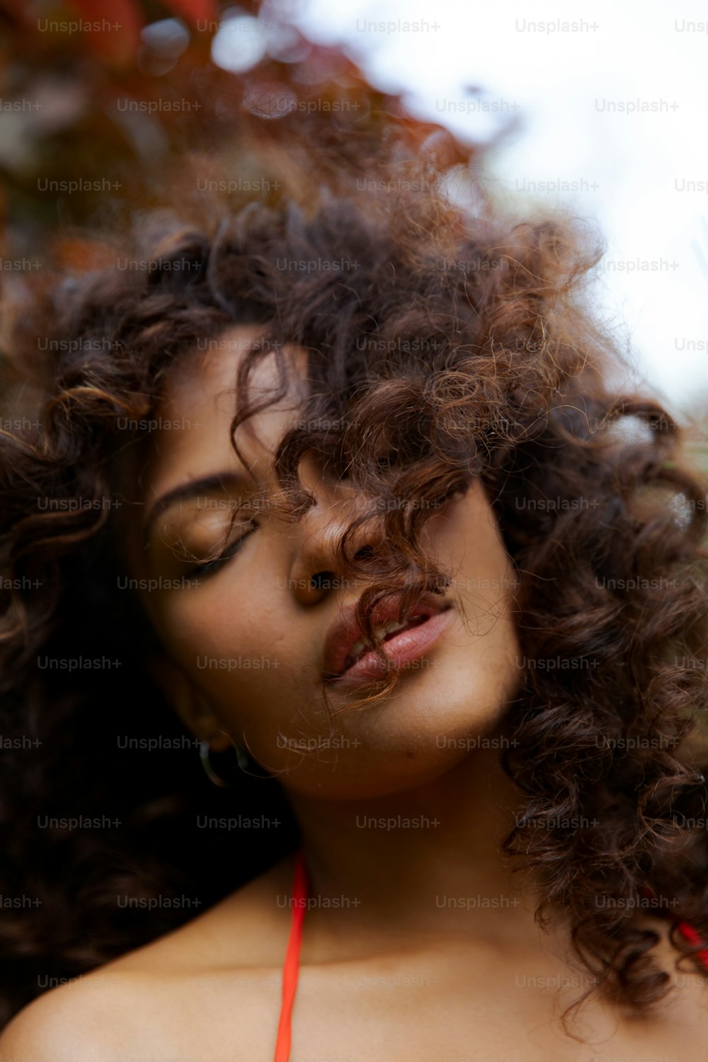 a close up of a woman with curly hair