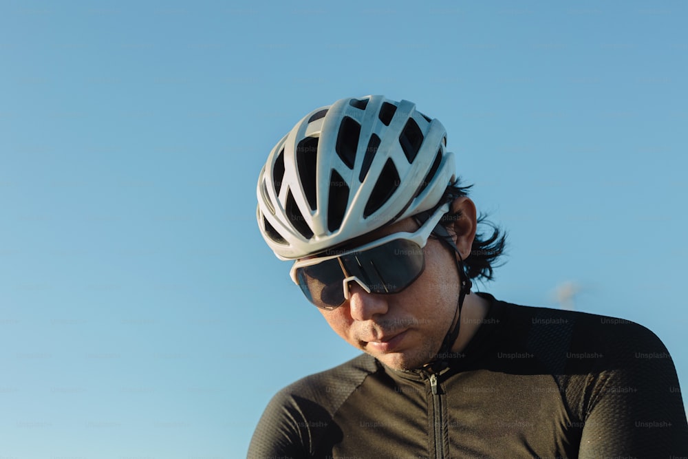 a close up of a person wearing a bike helmet