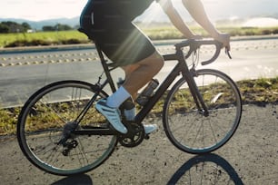 a person riding a bike on a road