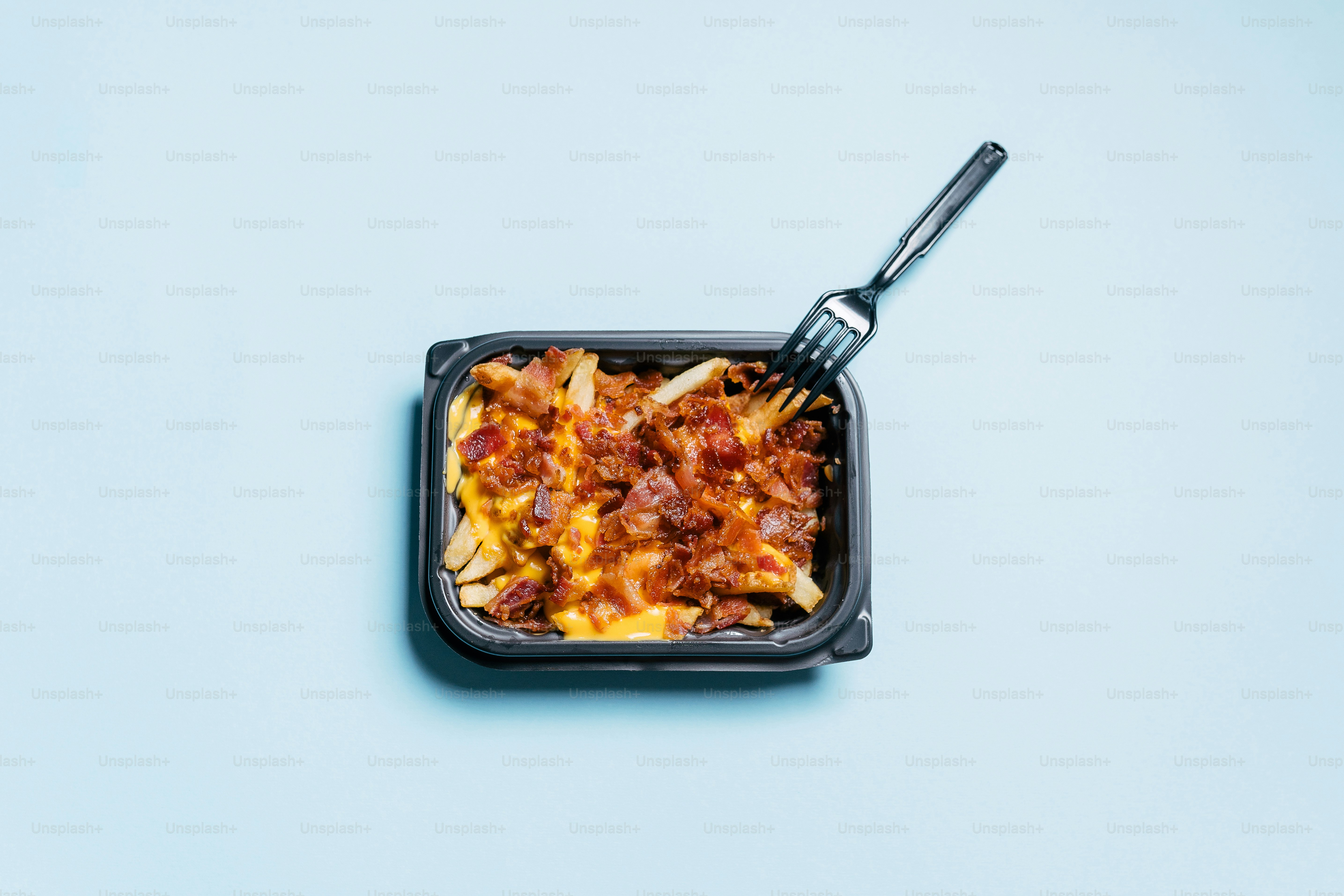 a container of food with a fork sticking out of it