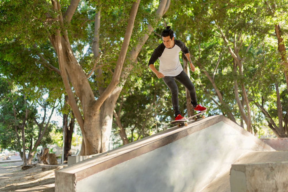 a man riding a skateboard down the side of a ramp