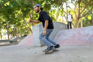 a man riding a skateboard down the side of a ramp