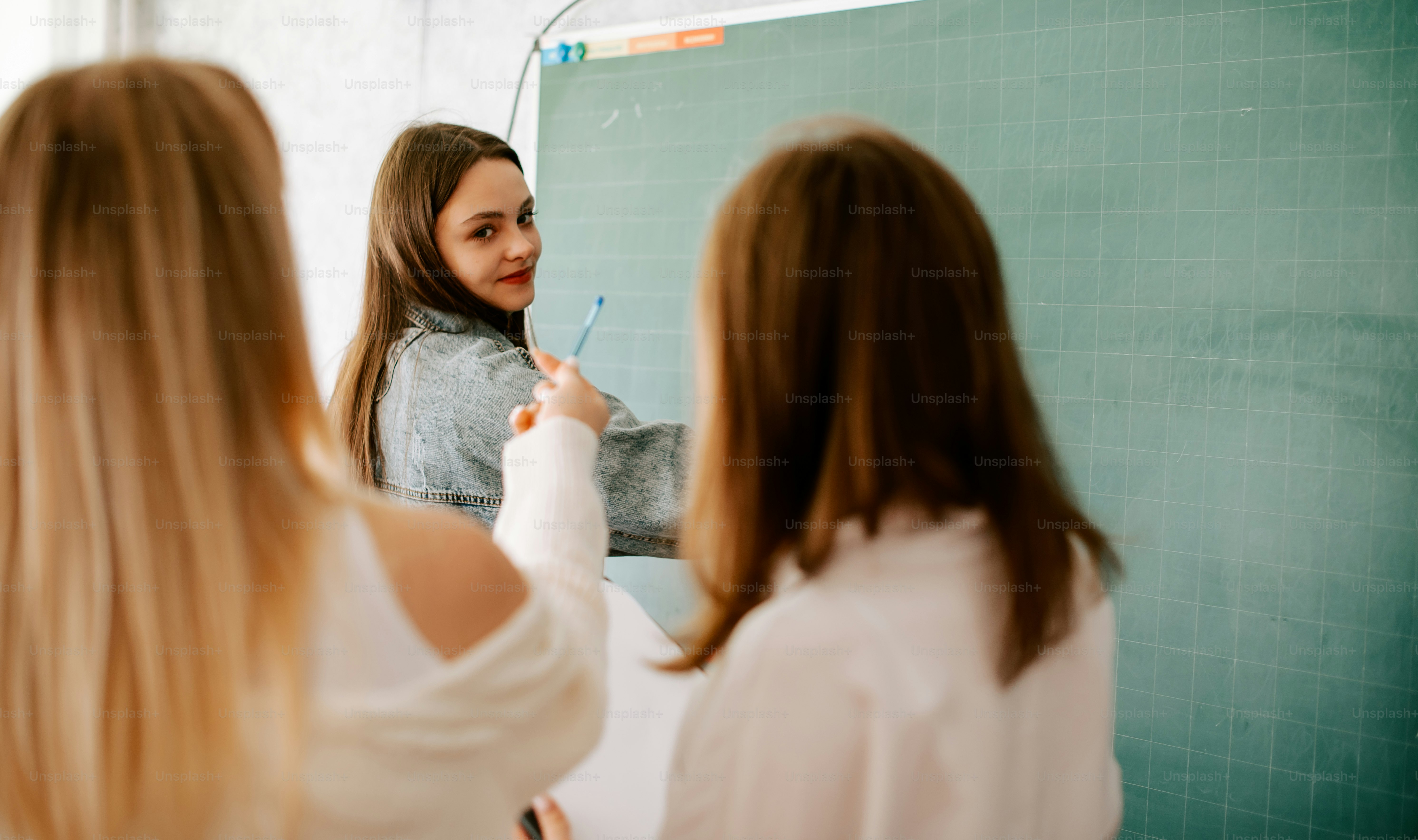 a woman brushing her teeth in front of a mirror