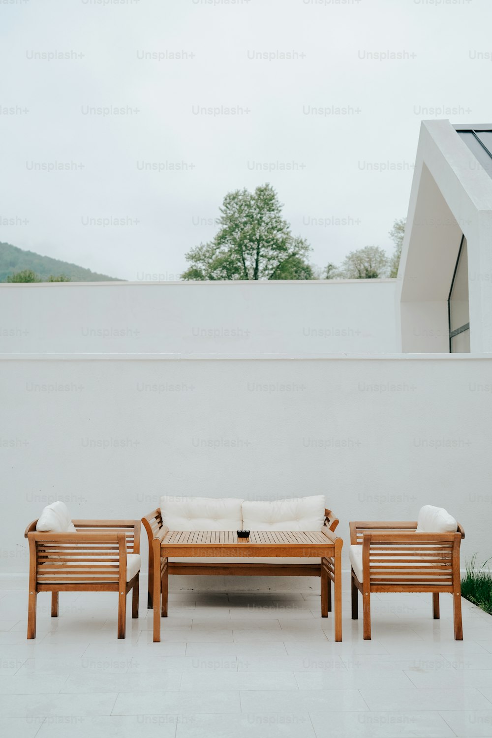 a couple of wooden benches sitting on top of a white floor