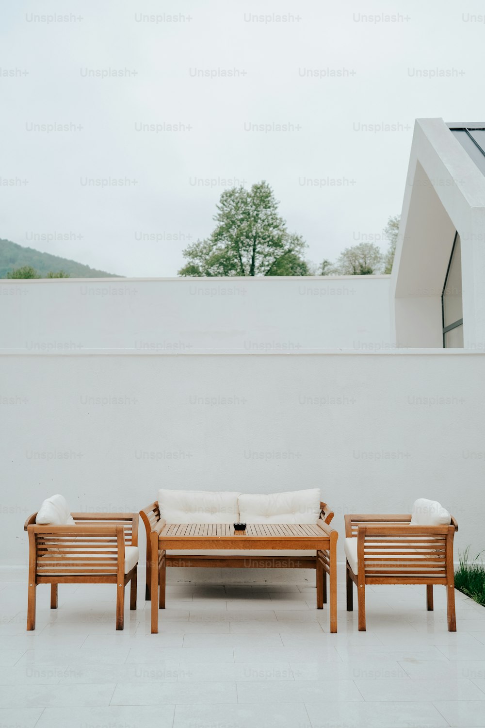 a couple of wooden benches sitting on top of a white floor