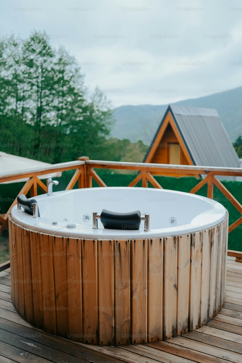 a hot tub sitting on top of a wooden deck