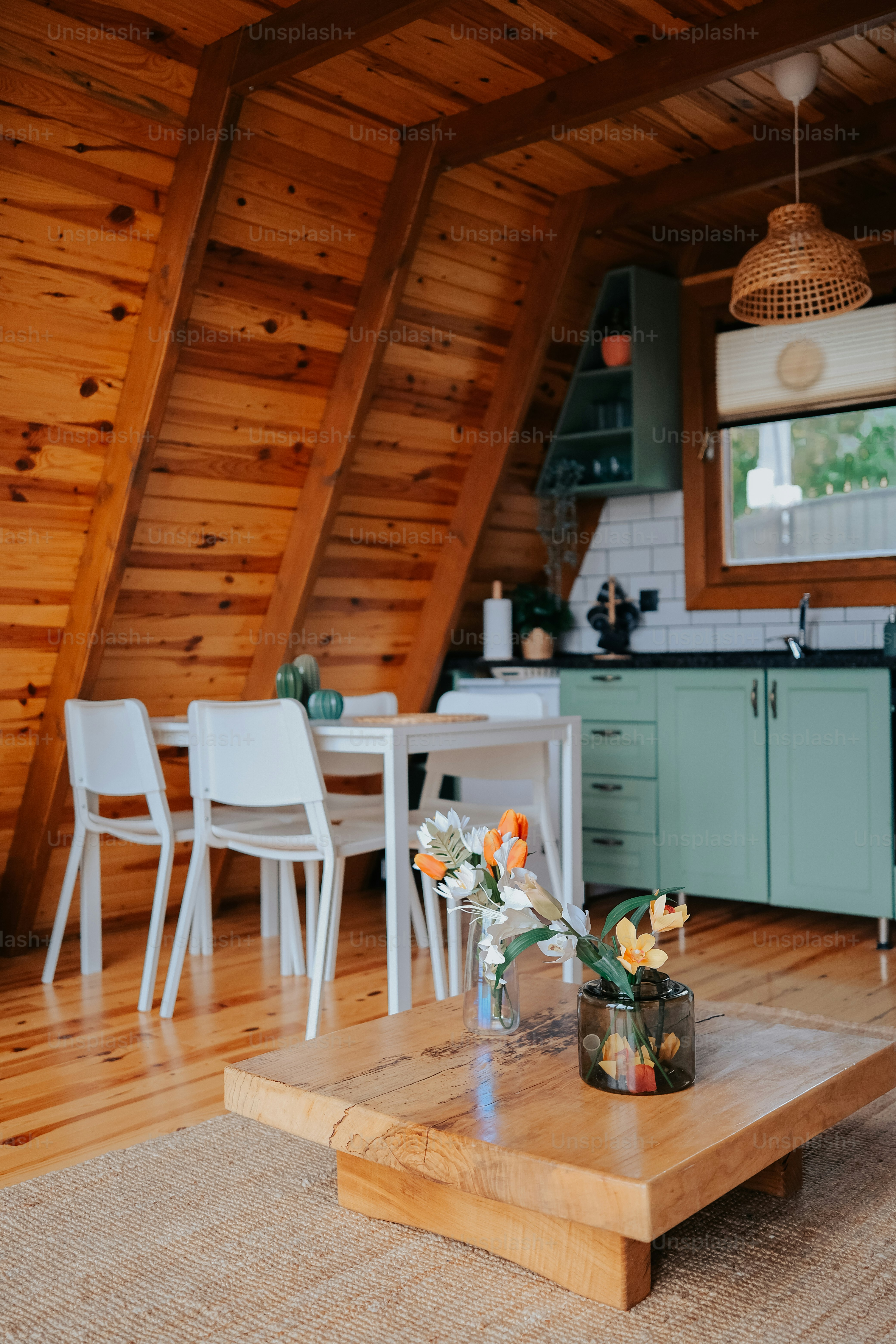a table with a vase of flowers on top of it