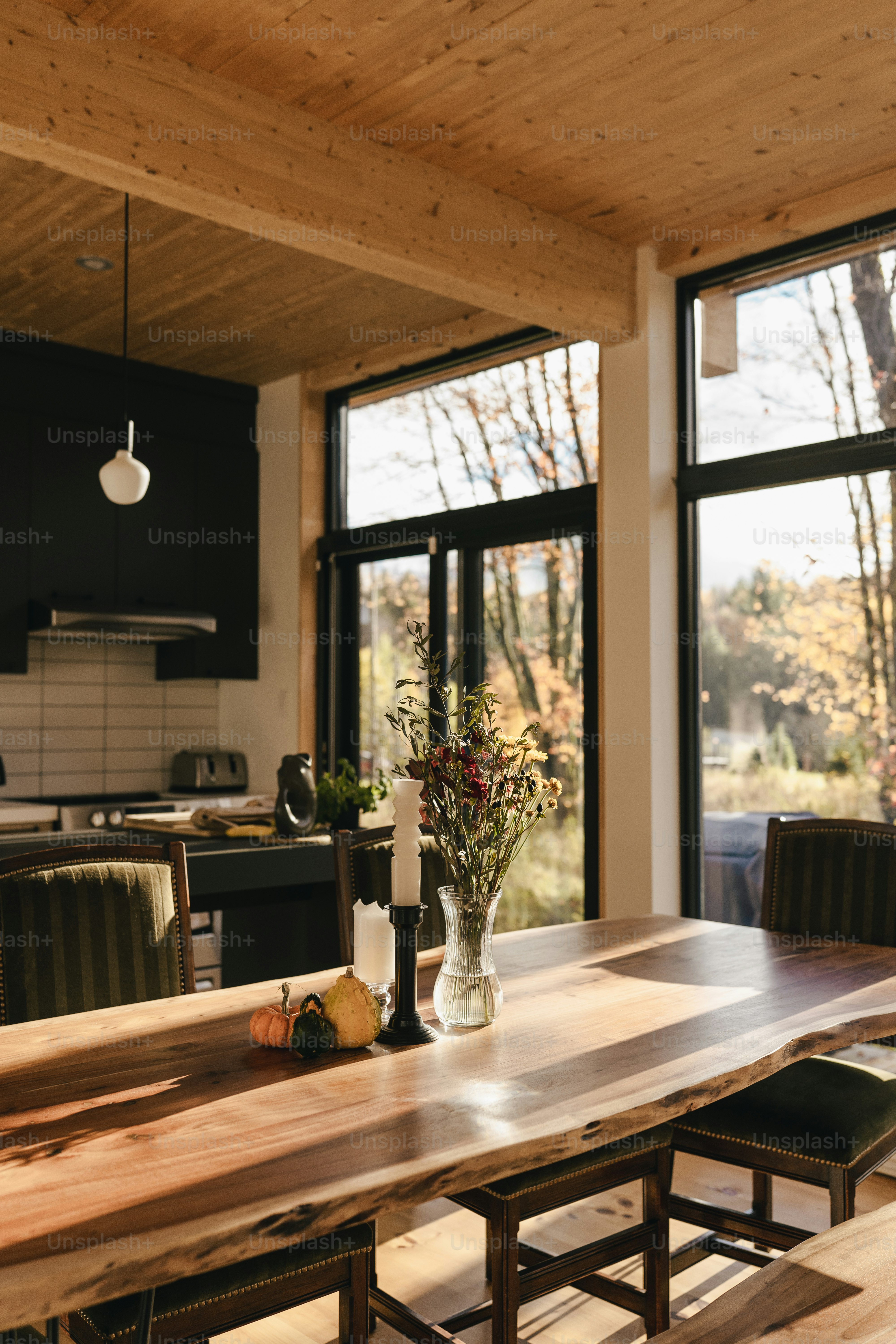 a wooden table with a vase of flowers on top of it