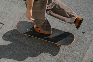 a man riding a skateboard down a sidewalk