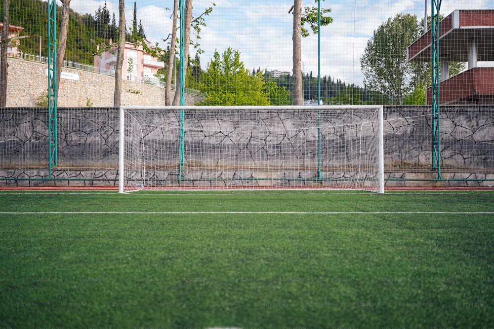 a soccer field with a goal and a net