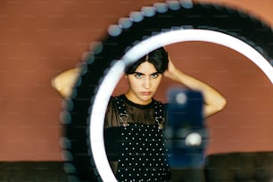 a woman taking a picture of herself in a mirror