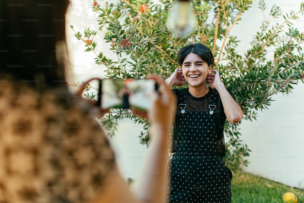 a woman taking a picture of herself in a mirror