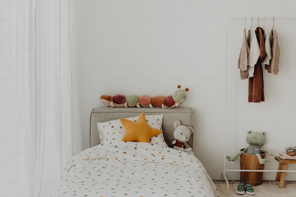 a bedroom with a bed with a polka dot comforter