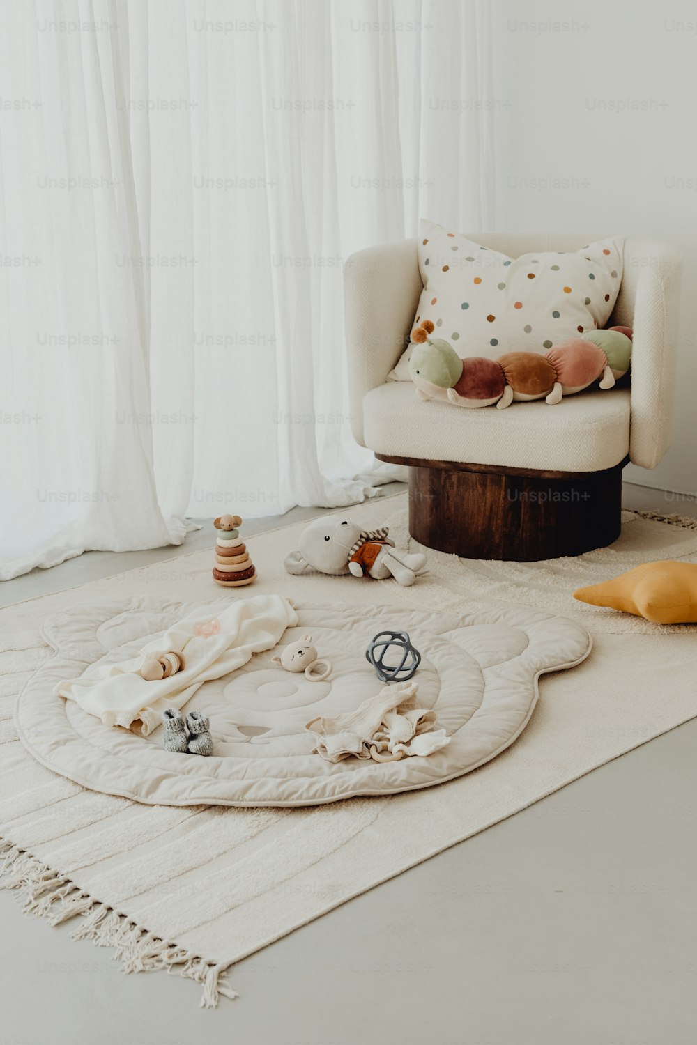 a living room with a white rug and a chair