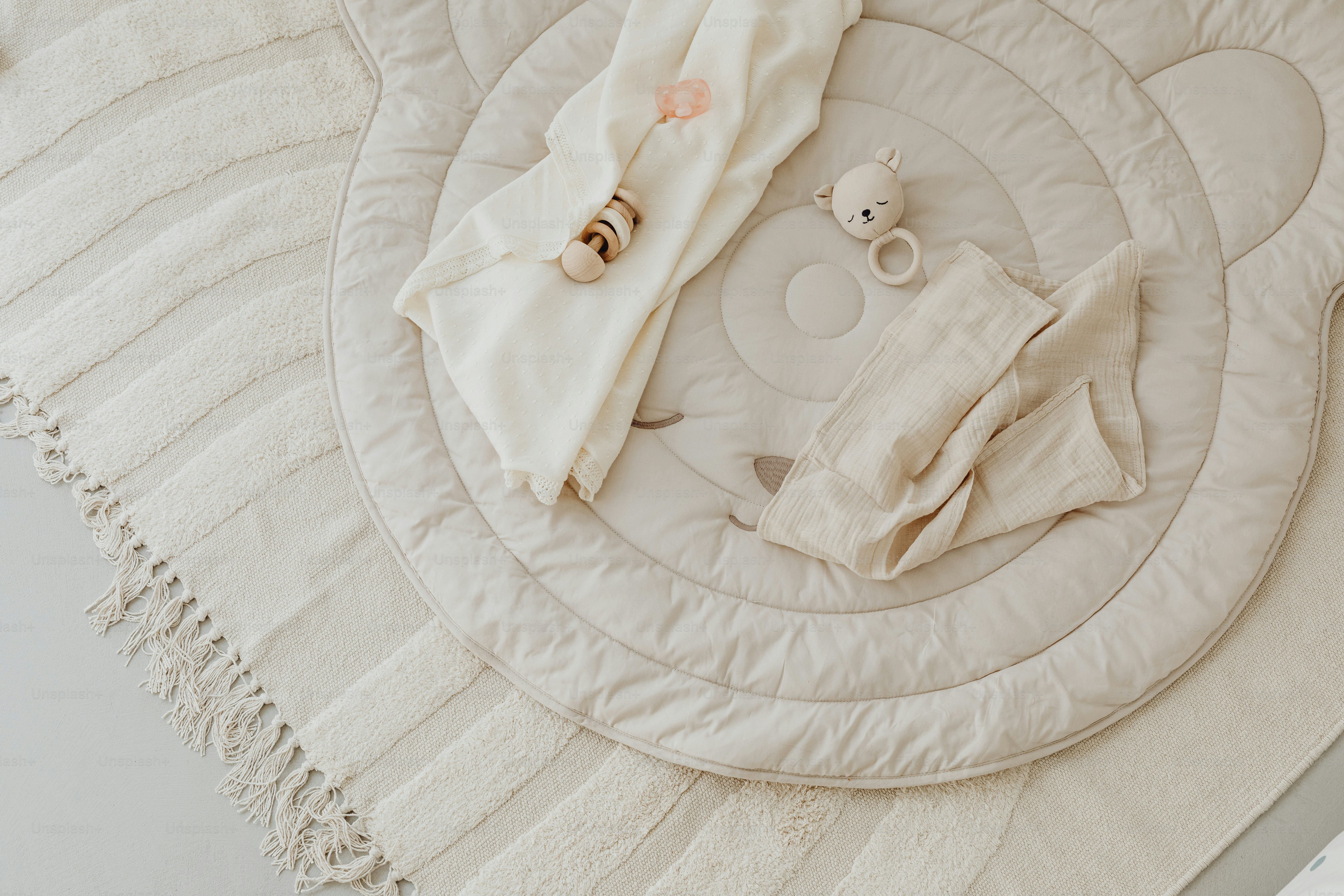 a baby's diaper is laying on top of a blanket