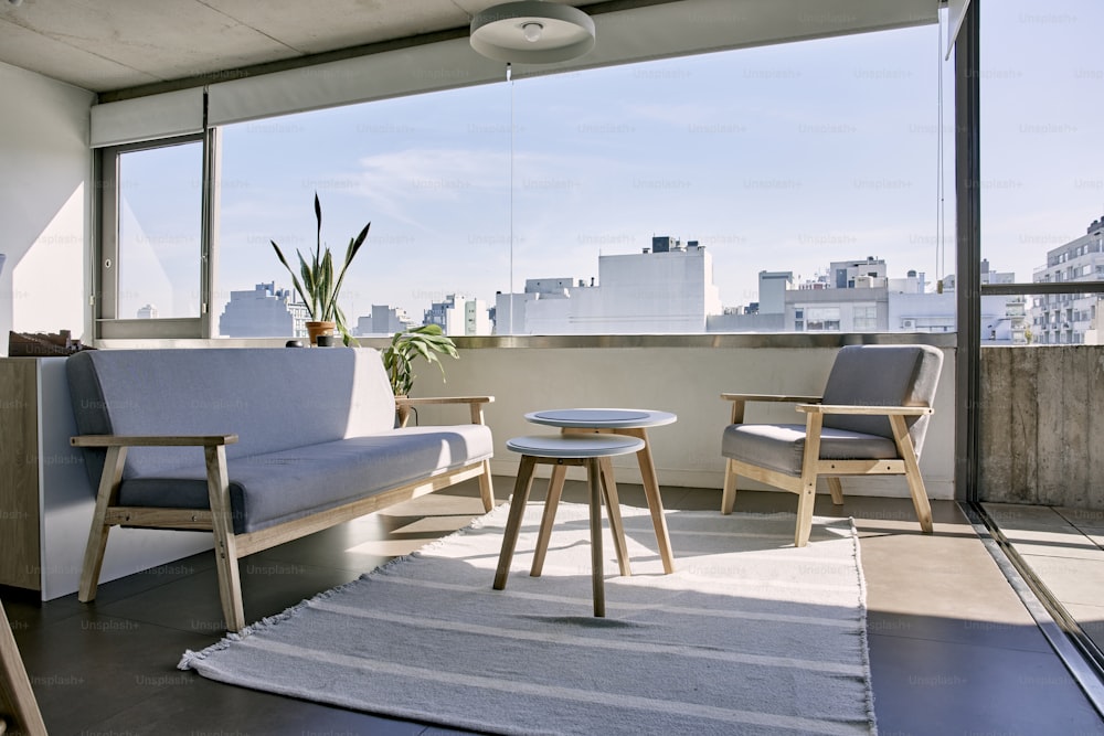 a living room with a couch and two chairs