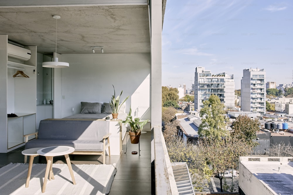 a balcony with a couch and a table on it