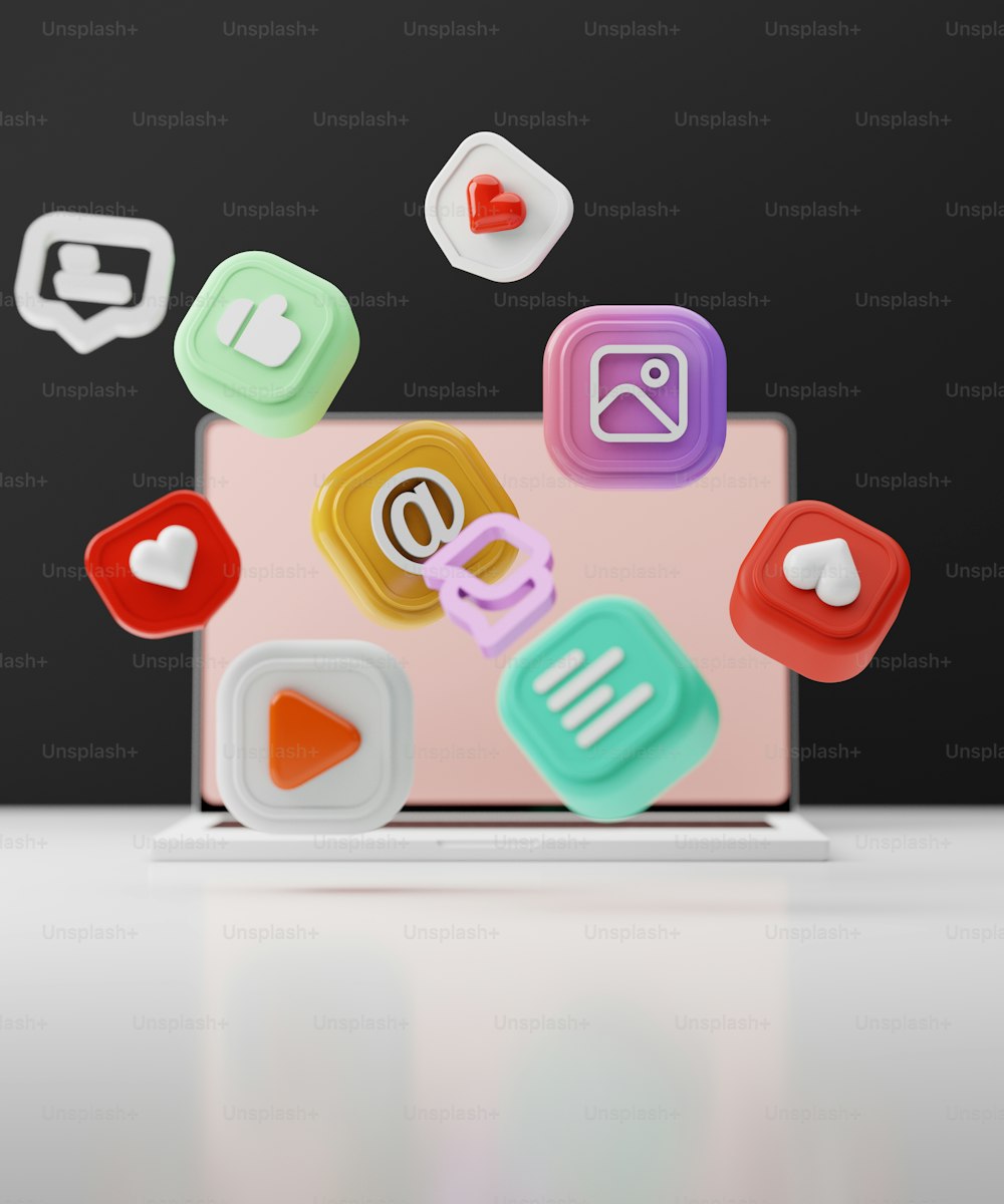 Un laptop con un sacco di icone di app che escono da esso