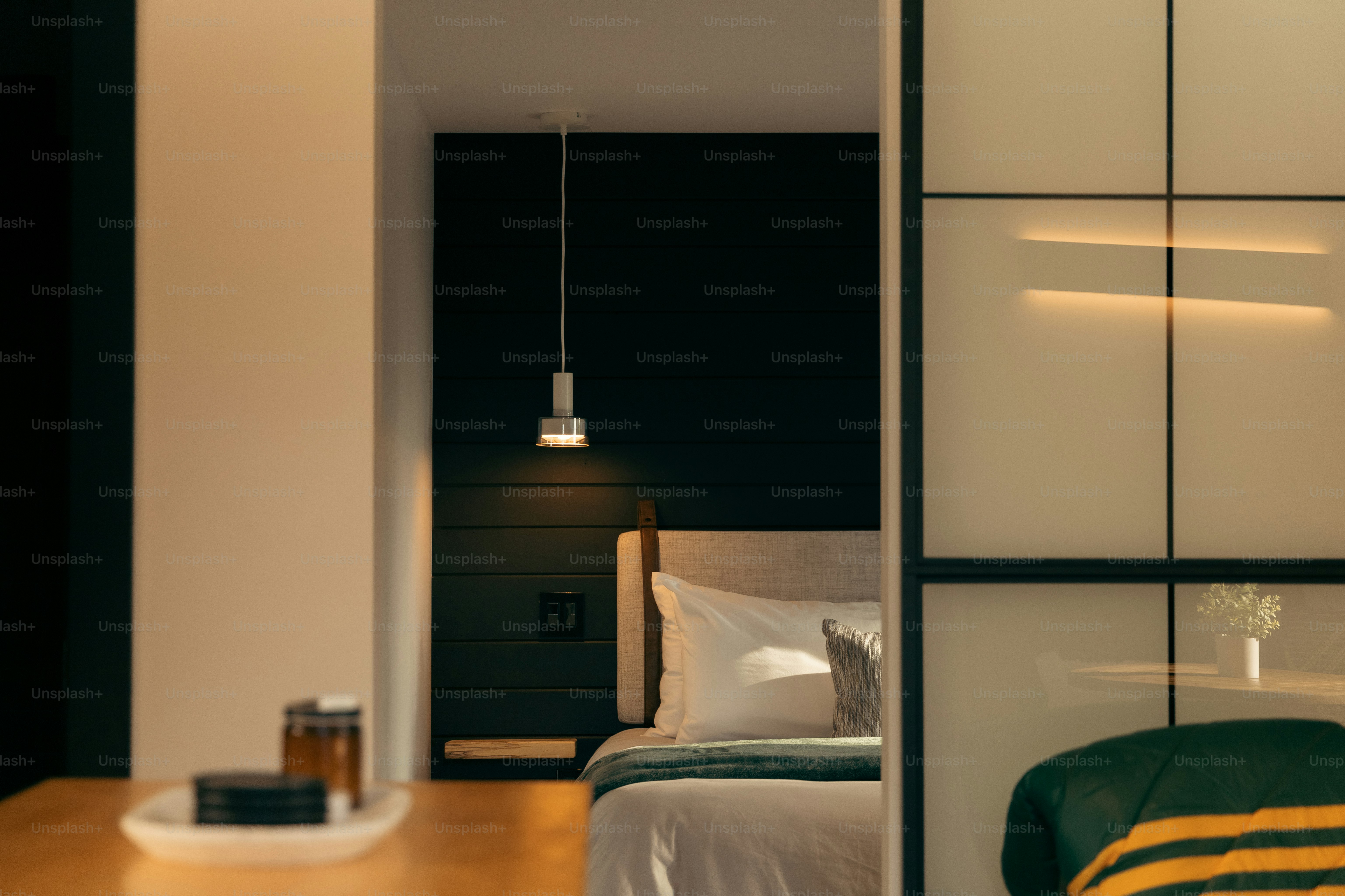 a bedroom with a bed and a desk in it