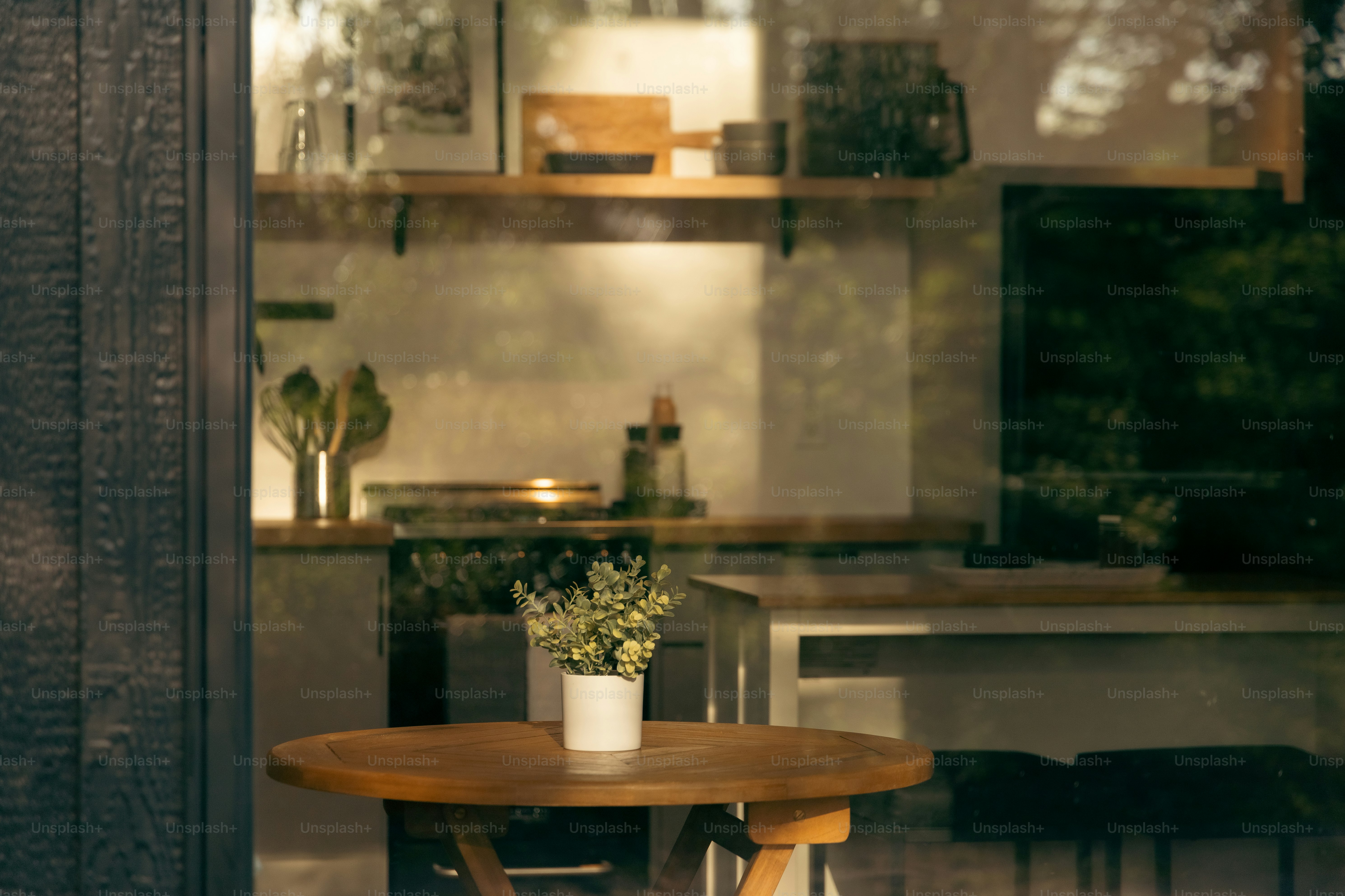 a table with a potted plant sitting on top of it