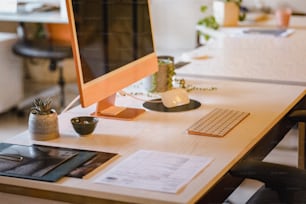 a desktop computer sitting on top of a wooden desk