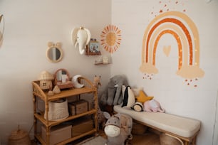 a child's room with a rainbow painted on the wall