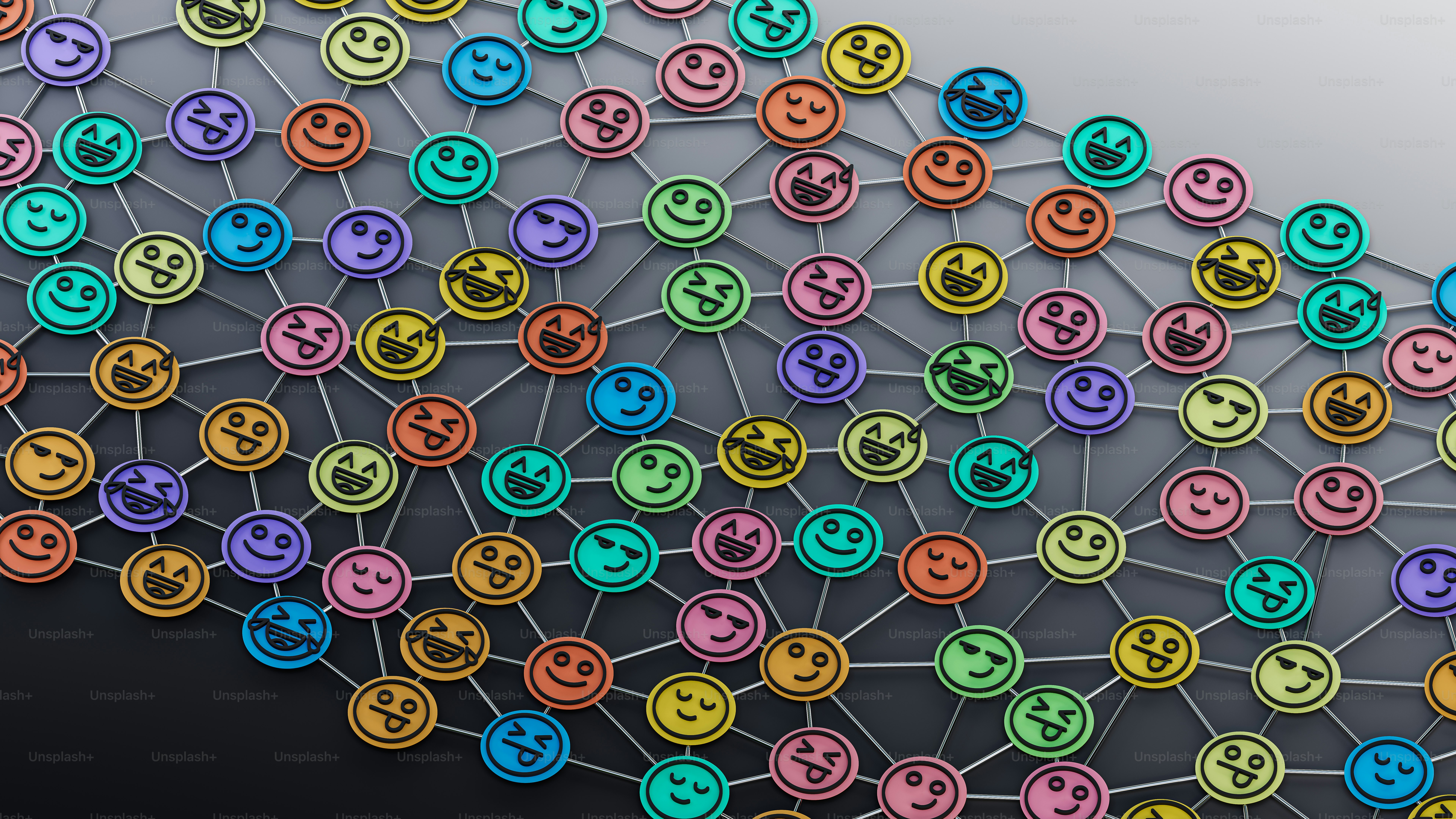 Un montón de caras sonrientes coloridas sobre un fondo negro