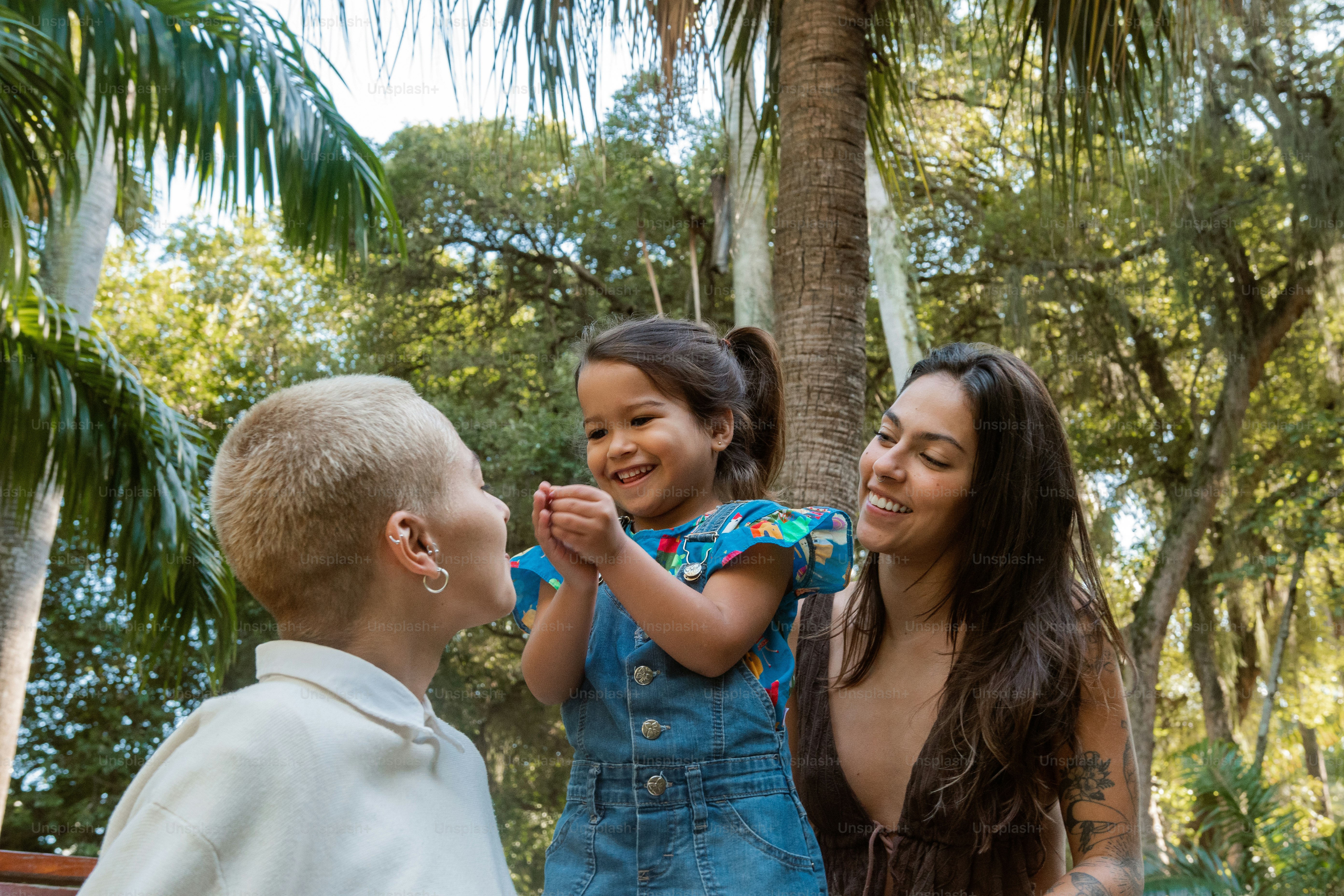 a woman and two children standing next to each other