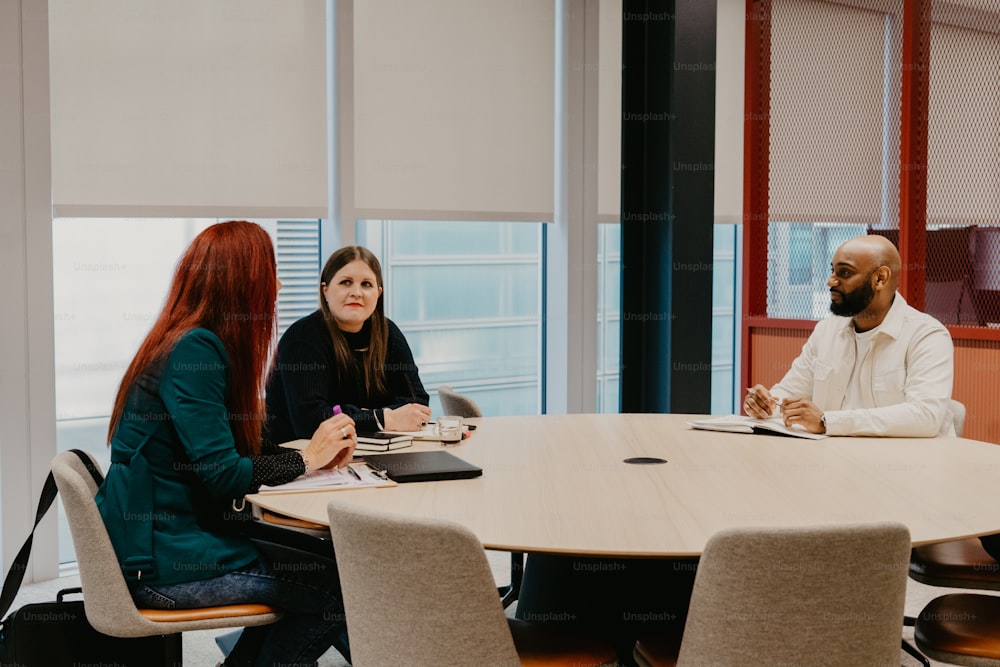 a group of people sitting around a table