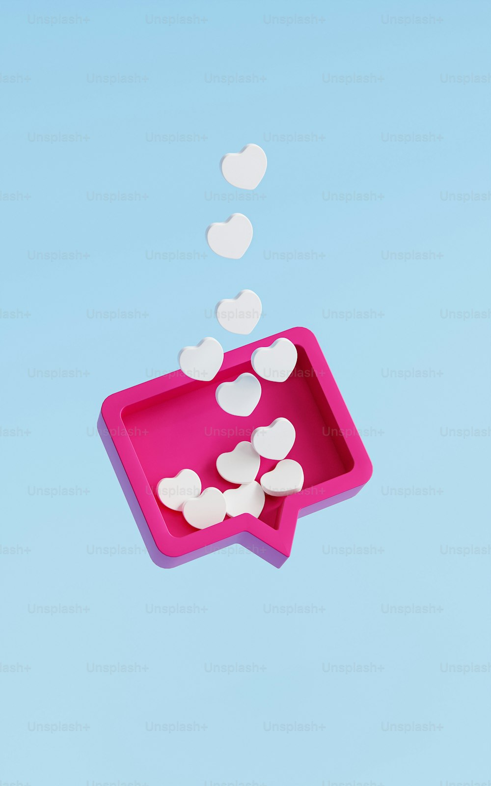 a pink bowl filled with white hearts floating in the air