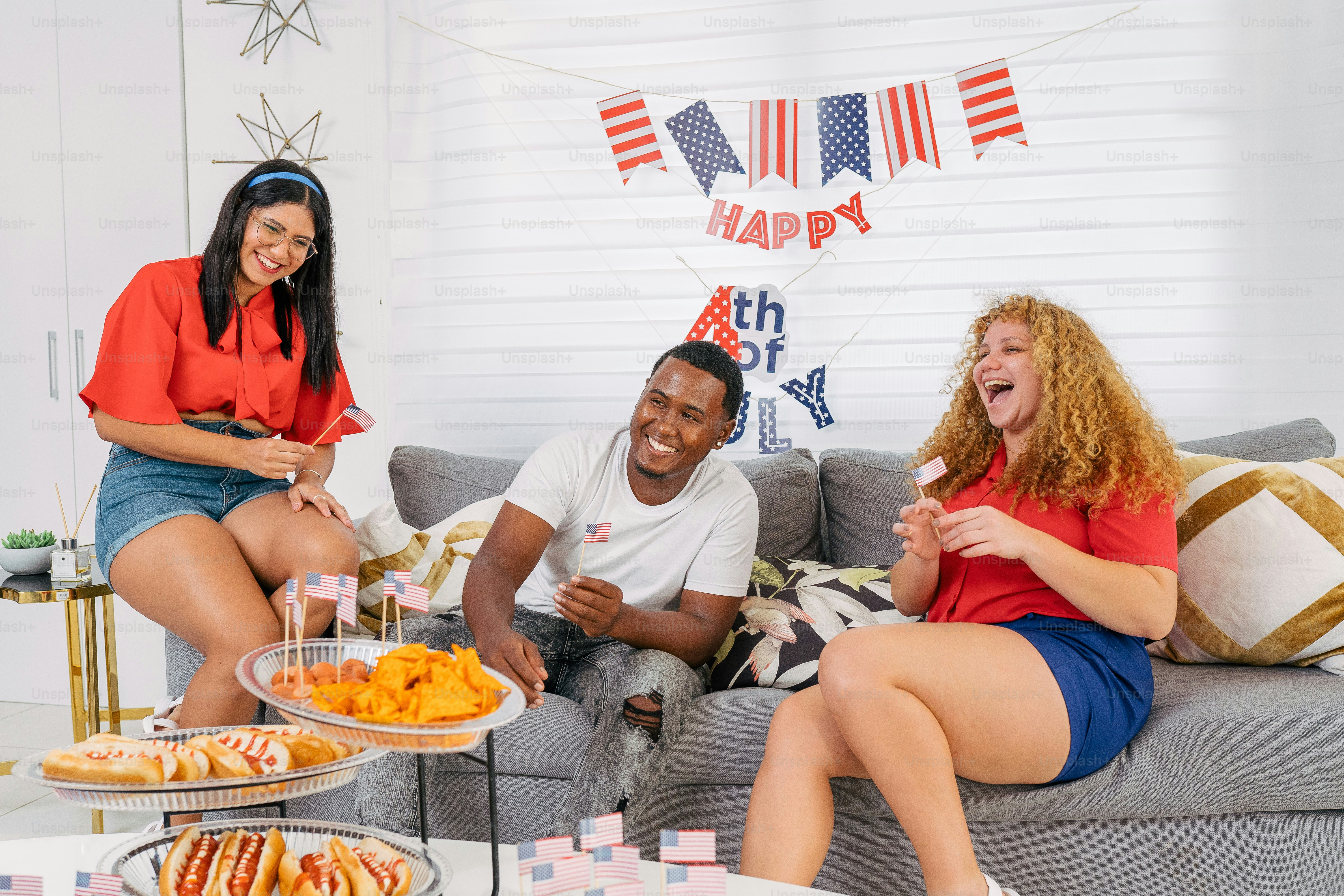 a group of people sitting on top of a couch