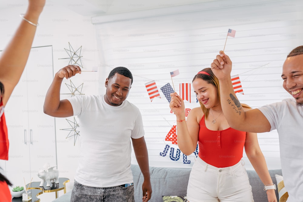 a group of people holding american flags in their hands