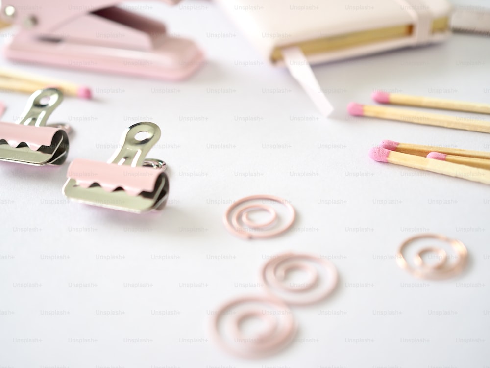 a pair of pink clips sitting on top of a table