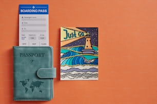a passport and a boarding pass on an orange background