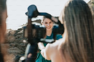 a woman is taking a picture of herself in front of a camera