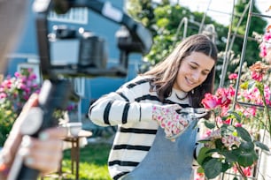 a woman holding a potted plant in her hands