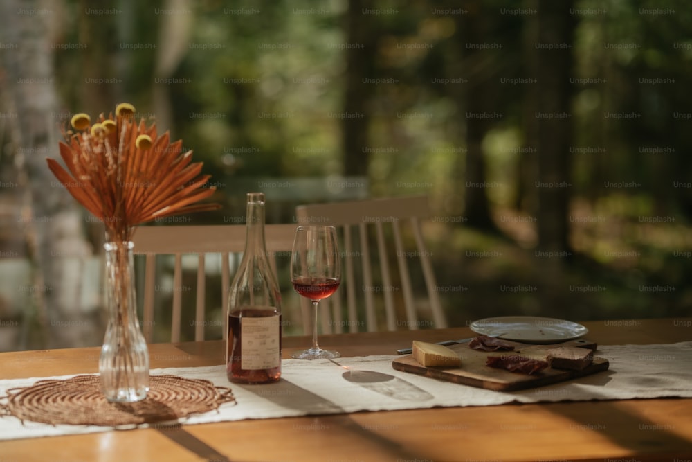 a wooden table topped with a vase filled with flowers