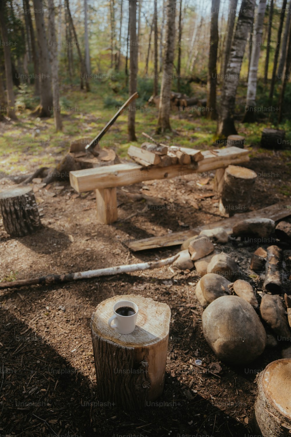 a wooden bench sitting in the middle of a forest