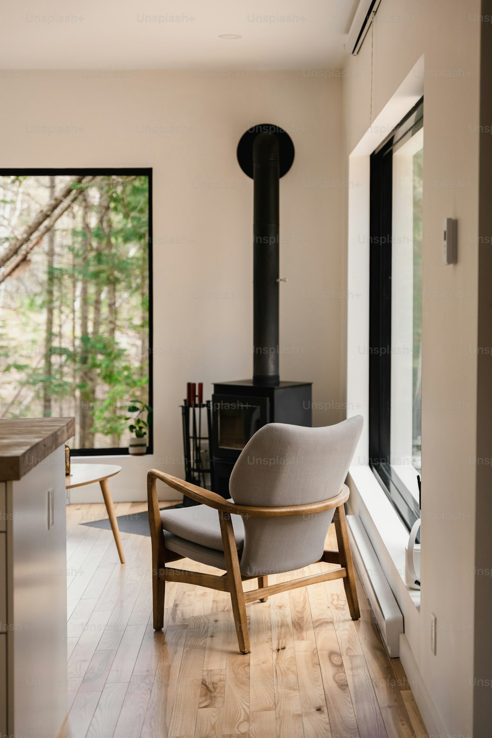 a chair sitting in a room next to a window