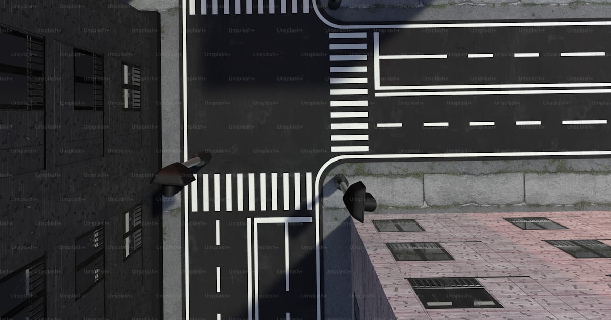 An aerial view of a city street from above photo – Side road Image on ...