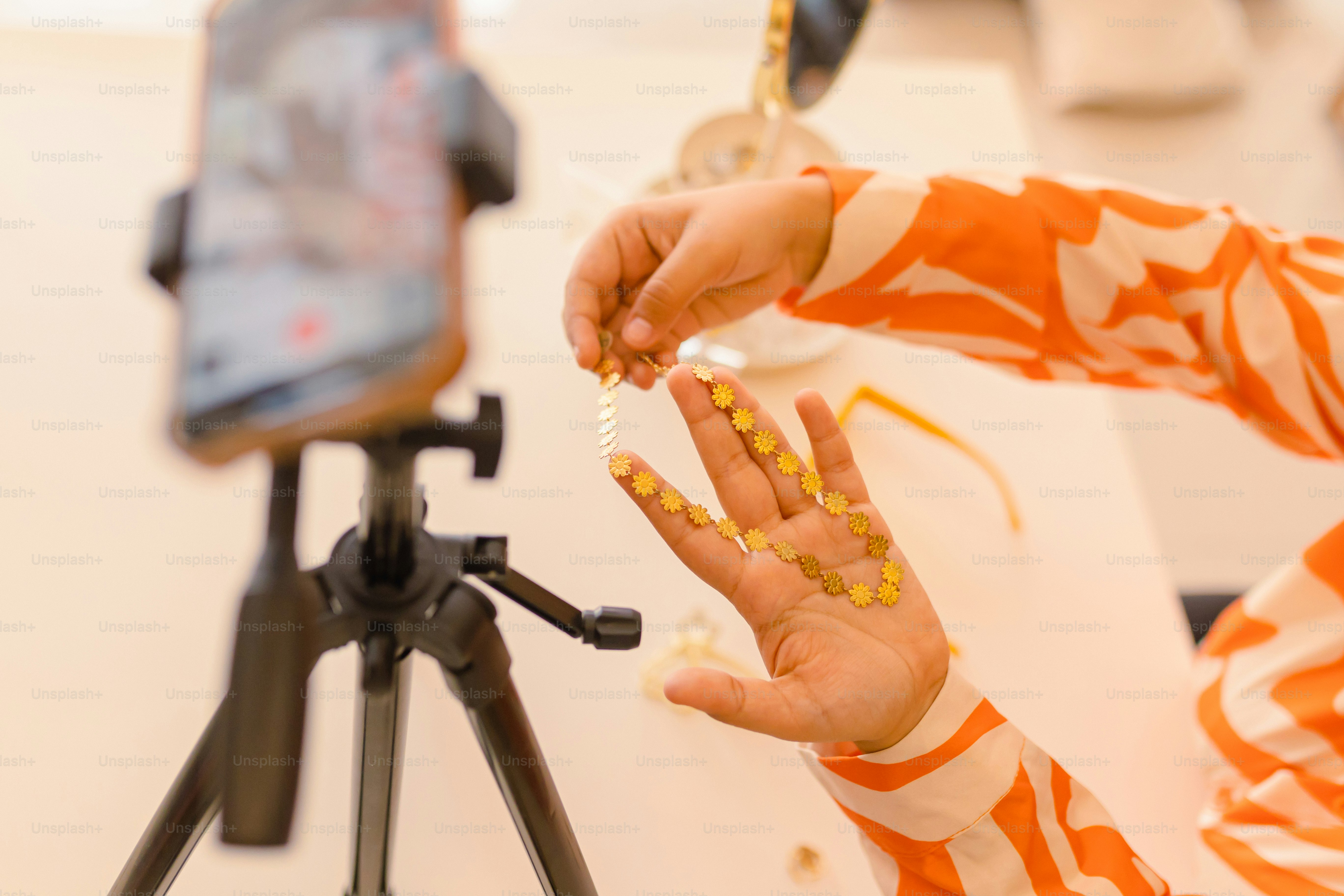 a person holding a handful of pills in front of a camera
